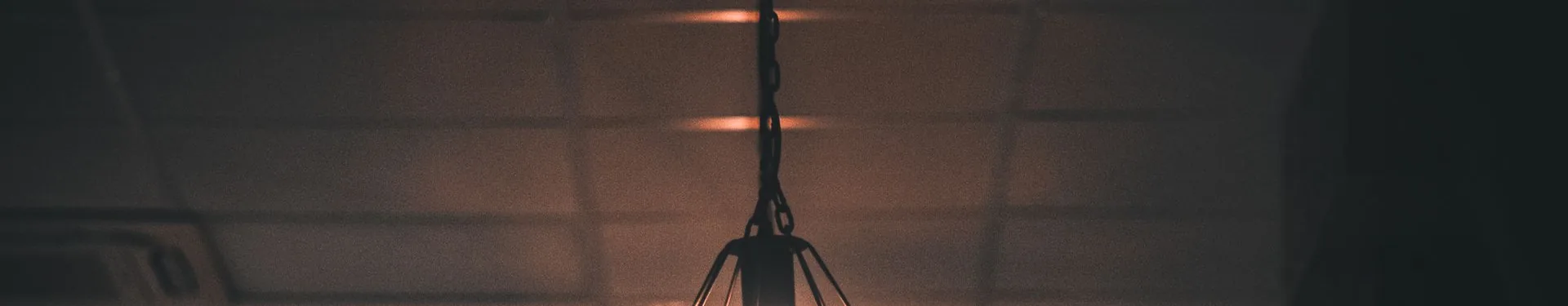 Warm pendant lights hanging from a ceiling
