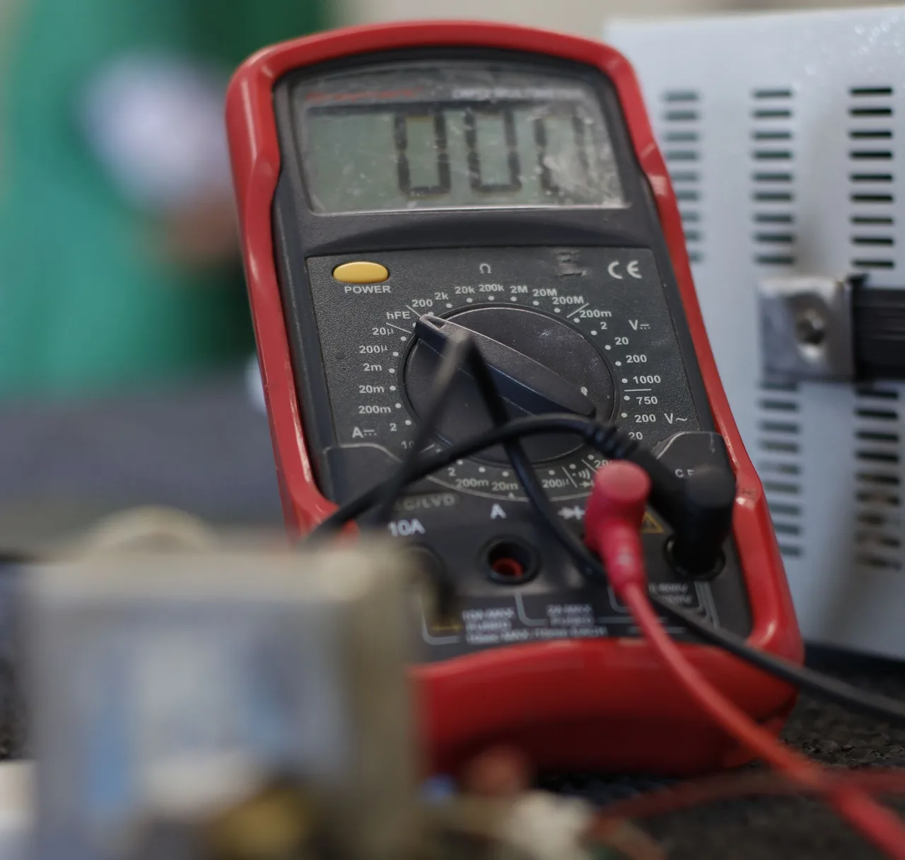 A digital multimeter with electrical test leads